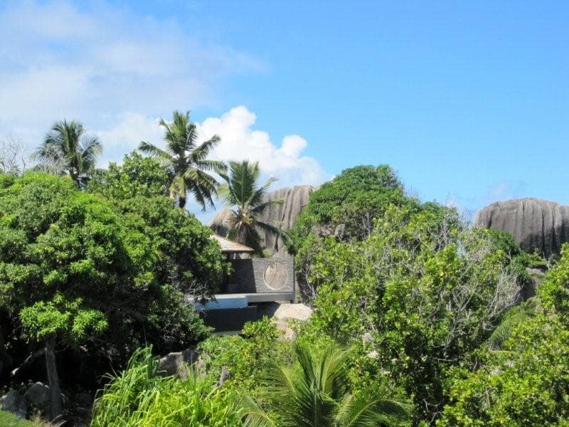 Norstone Charcoal Rock Panels used on a resort in the Seychelle Islands in Africa with Granite Domes in the background